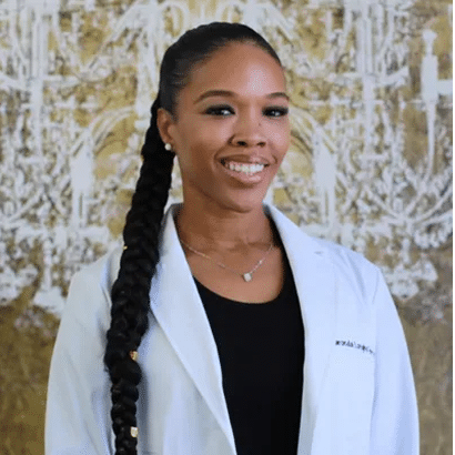 Smiling female dermatologist in lab coat representing Pasadena dermatologist services at Dynasty Dermatology Pasadena, CA