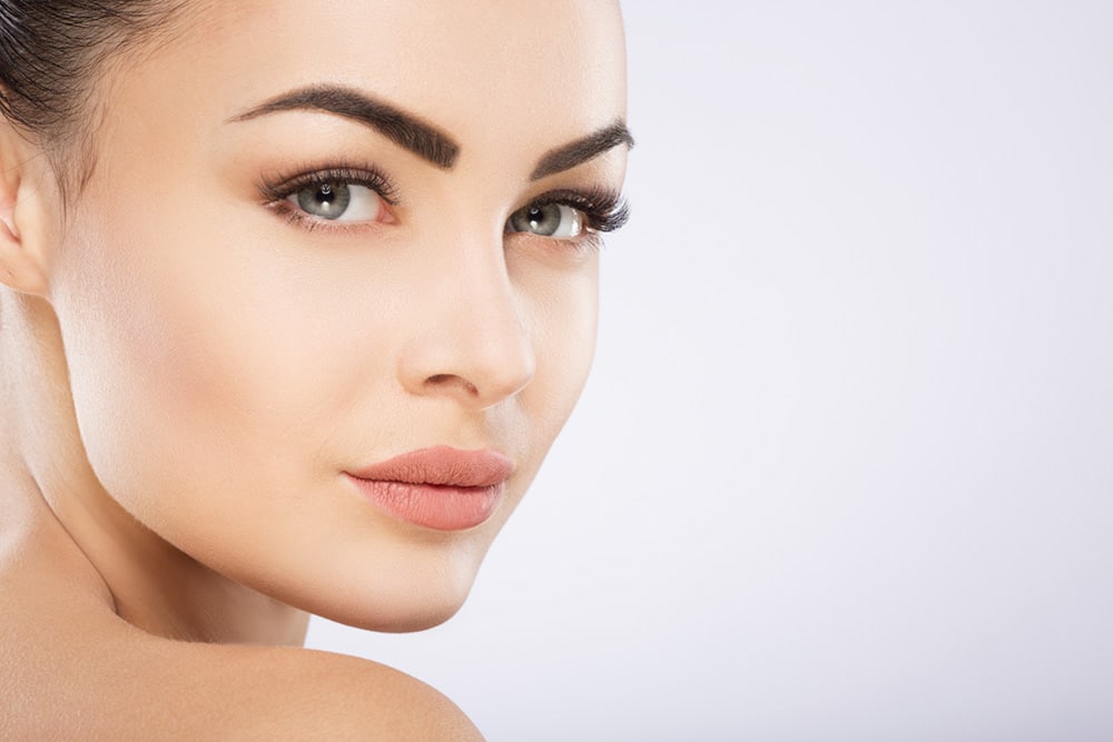 Close-up of woman with flawless skin showcasing Pasadena cosmetic dermatology results at Dynasty Dermatology Pasadena, CA