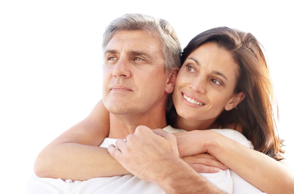 Middle-aged couple embracing after Pasadena anti-aging treatments at Dynasty Dermatology Pasadena, CA